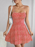 The cami dress with small flower prints a backless design and thin spaghetti straps is suitable for beach vacations and summer